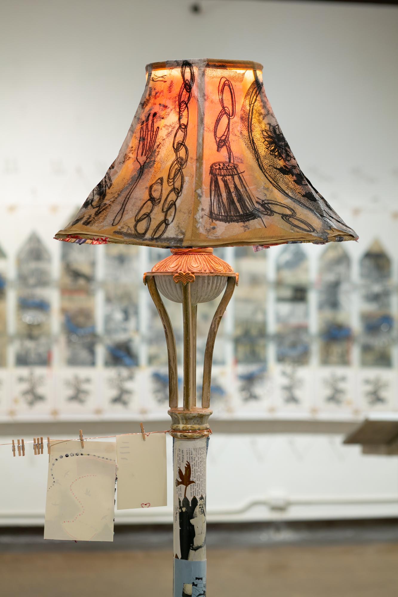 mixed-media installation - collage, monoprint, sewing with lamp, two chairs, two tables, audience participation archive