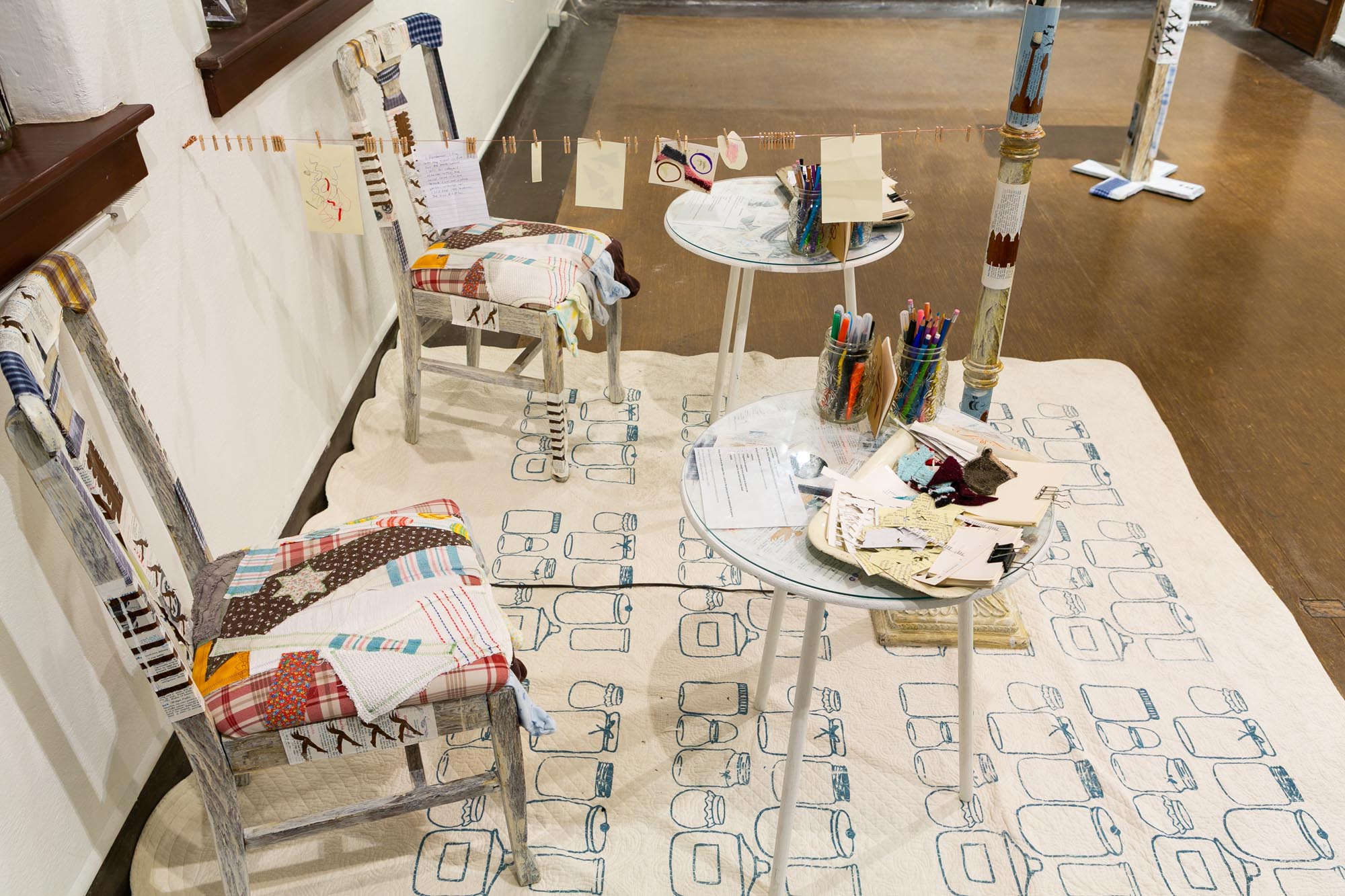 mixed-media installation - collage, monoprint, sewing with lamp, two chairs, two tables, audience participation archive