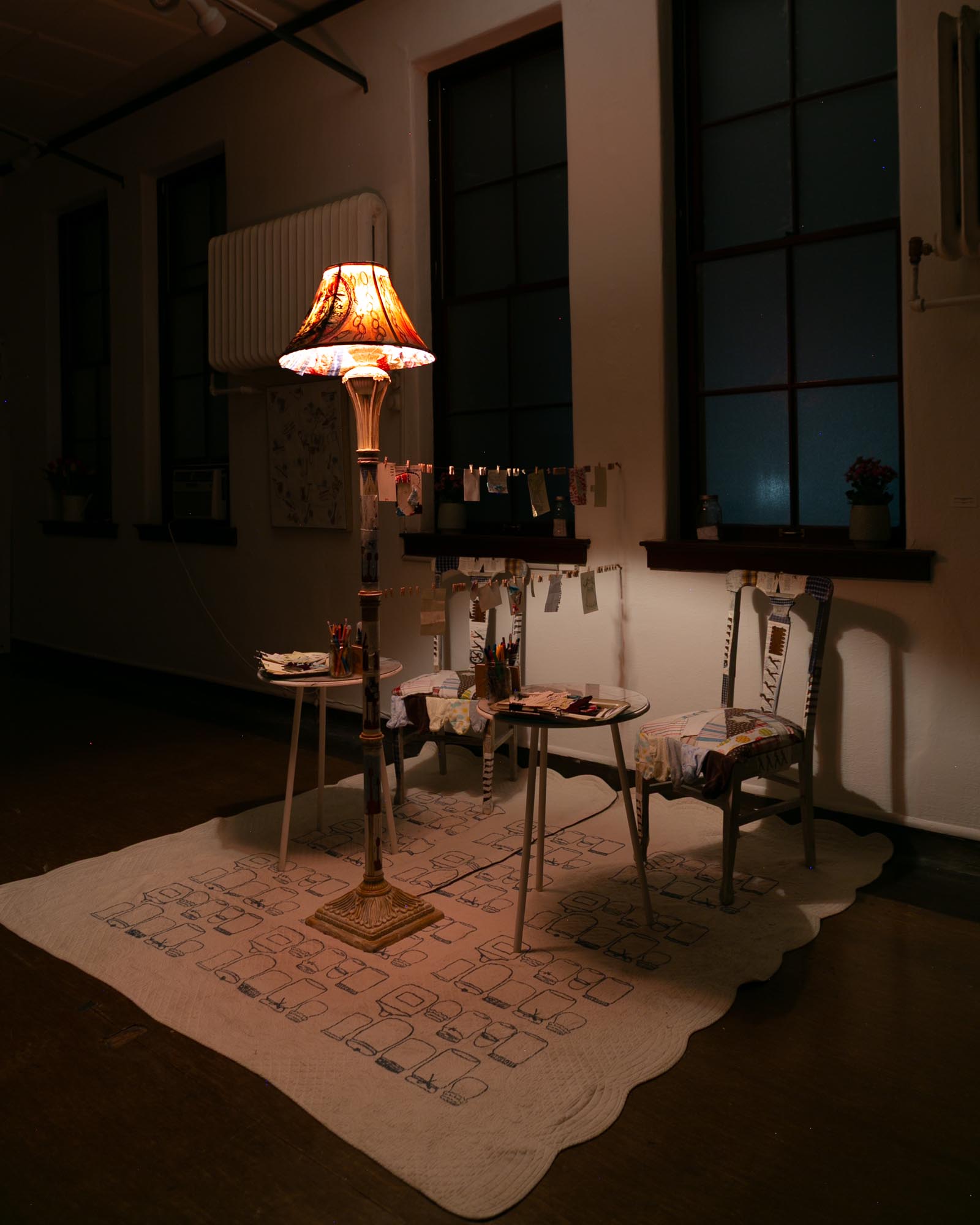 mixed-media installation - collage, monoprint, sewing with lamp, two chairs, two tables, audience participation archive