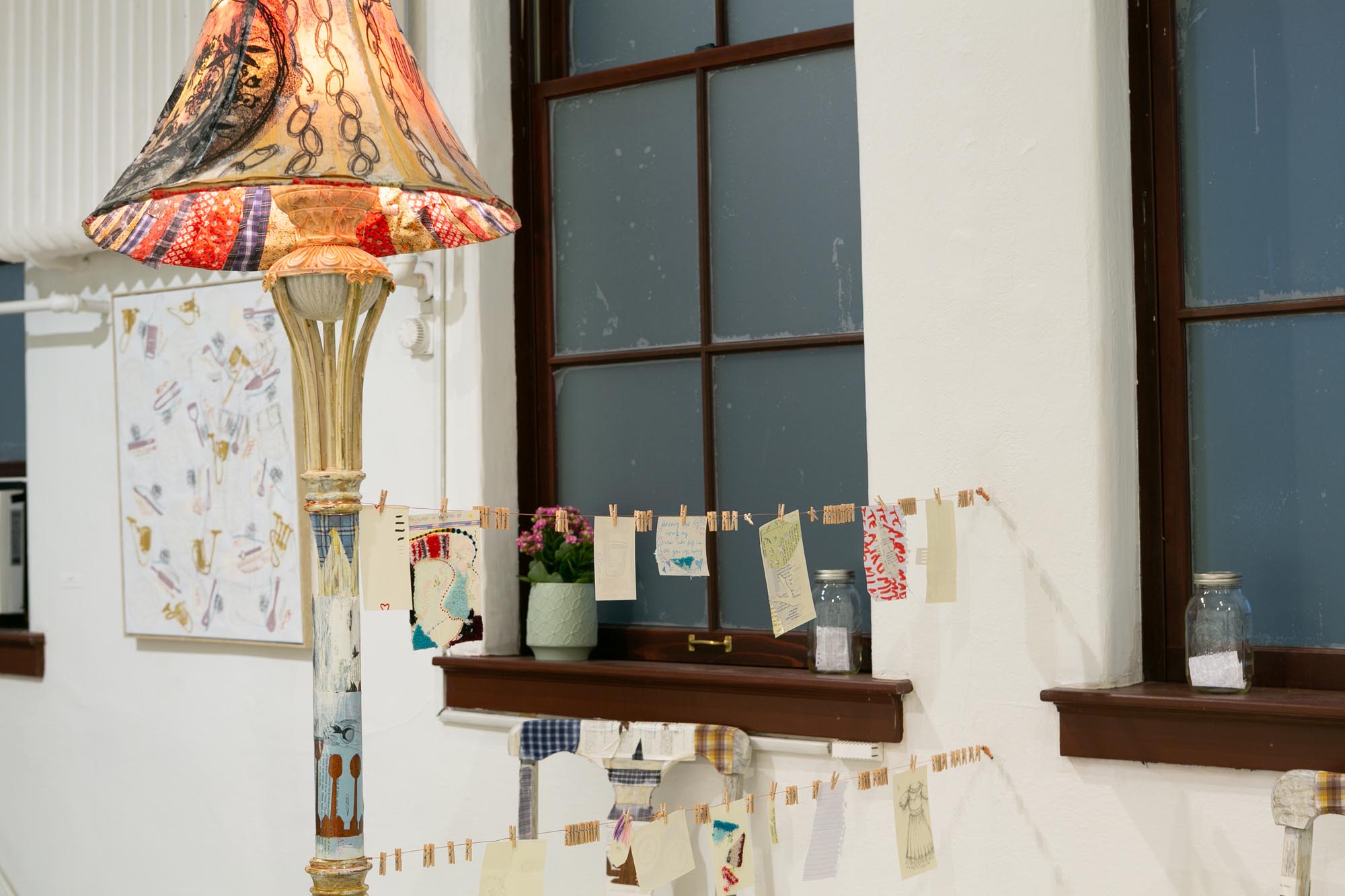 mixed-media installation - collage, monoprint, sewing with lamp, two chairs, two tables, audience participation archive
