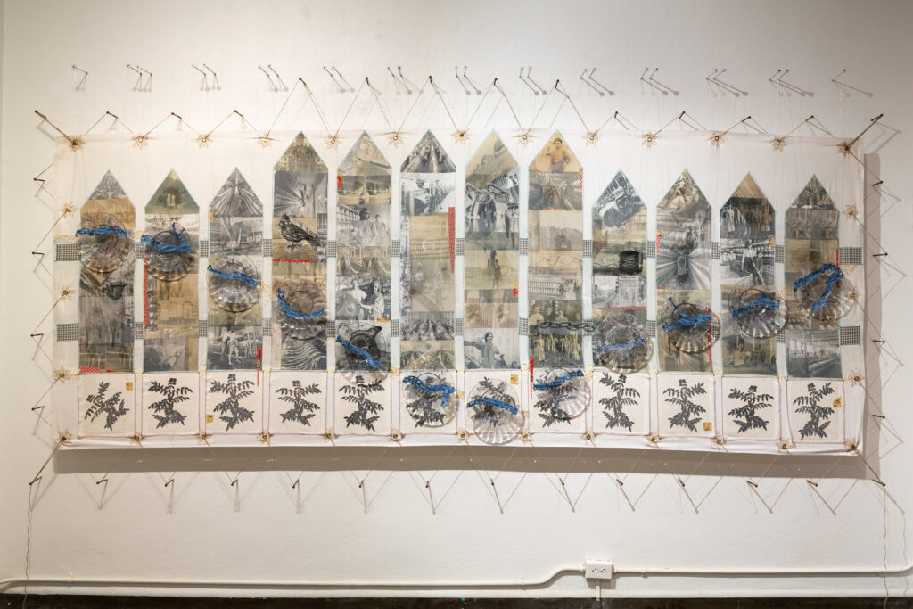 large mixed-media installation with collaged plates, photos, embroidery