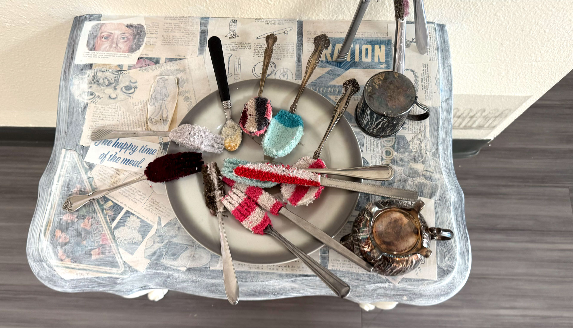 video installation of moving silver utensils with cloth
