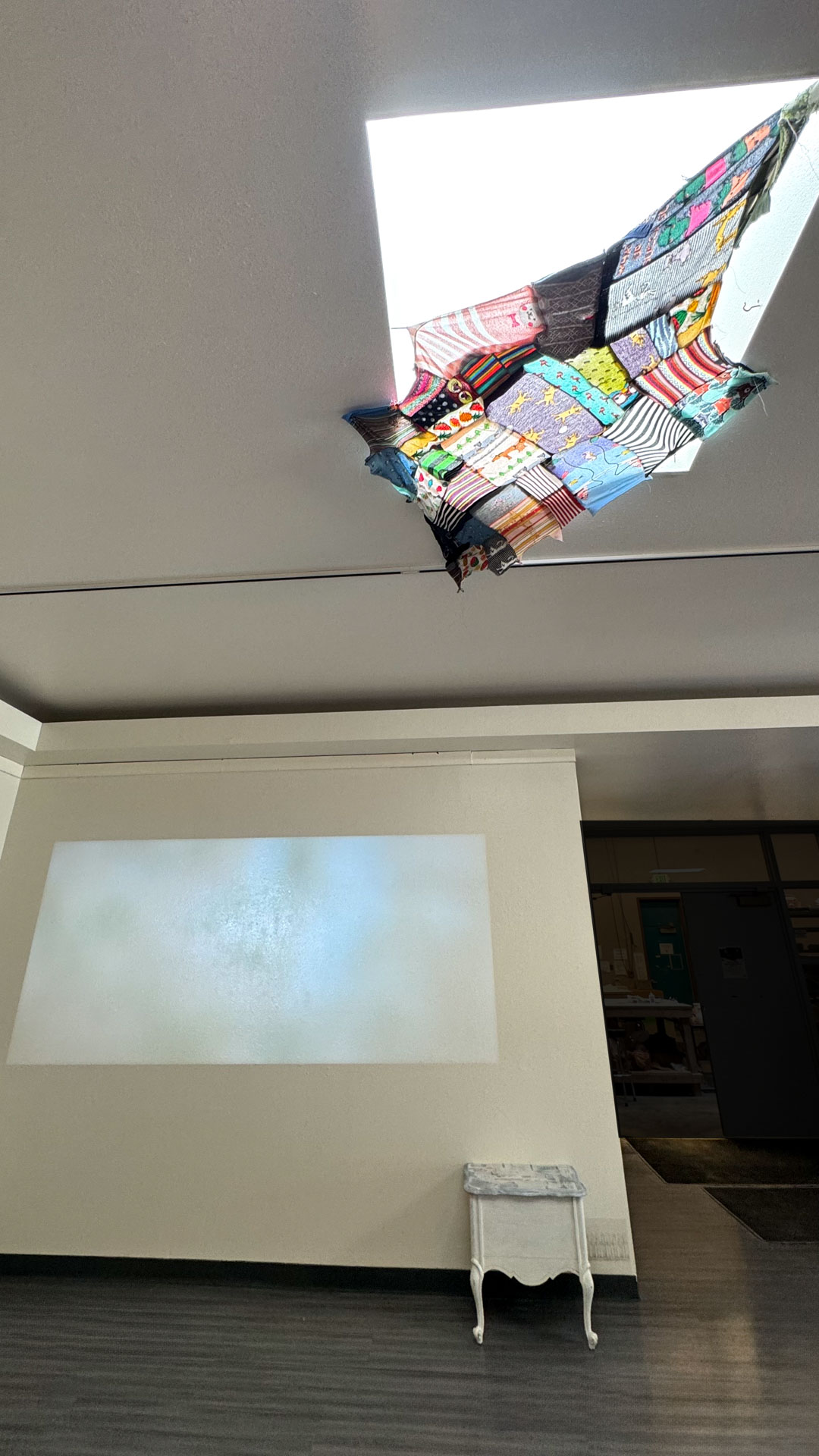 video installation of moving silver utensils with cloth
