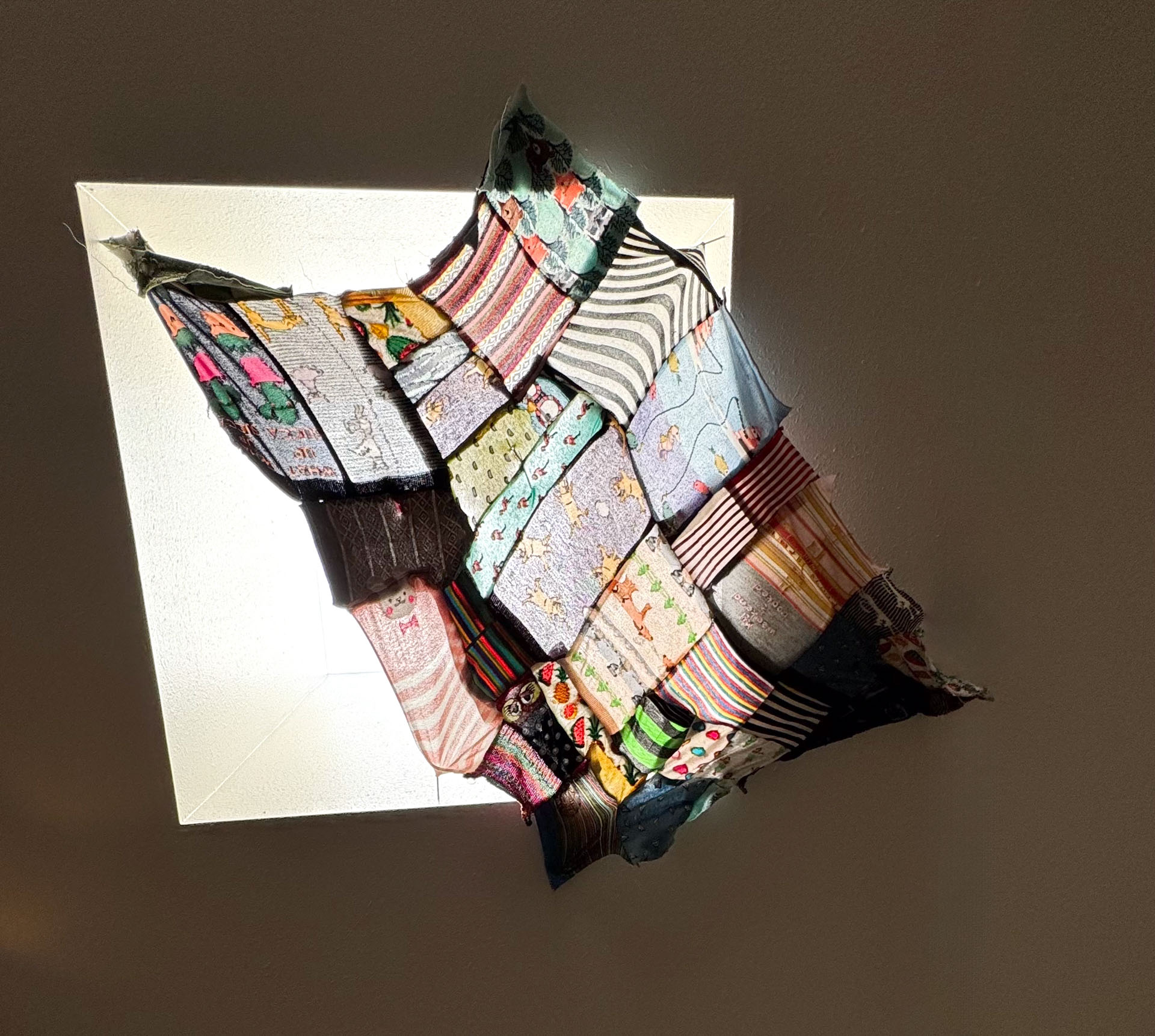 video installation of moving silver utensils with cloth