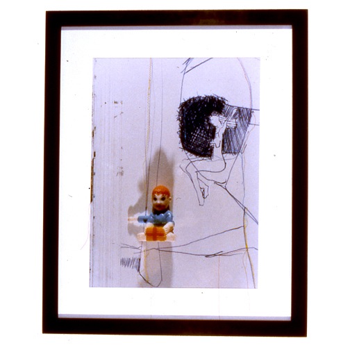 c-print color photo of sketches and toys