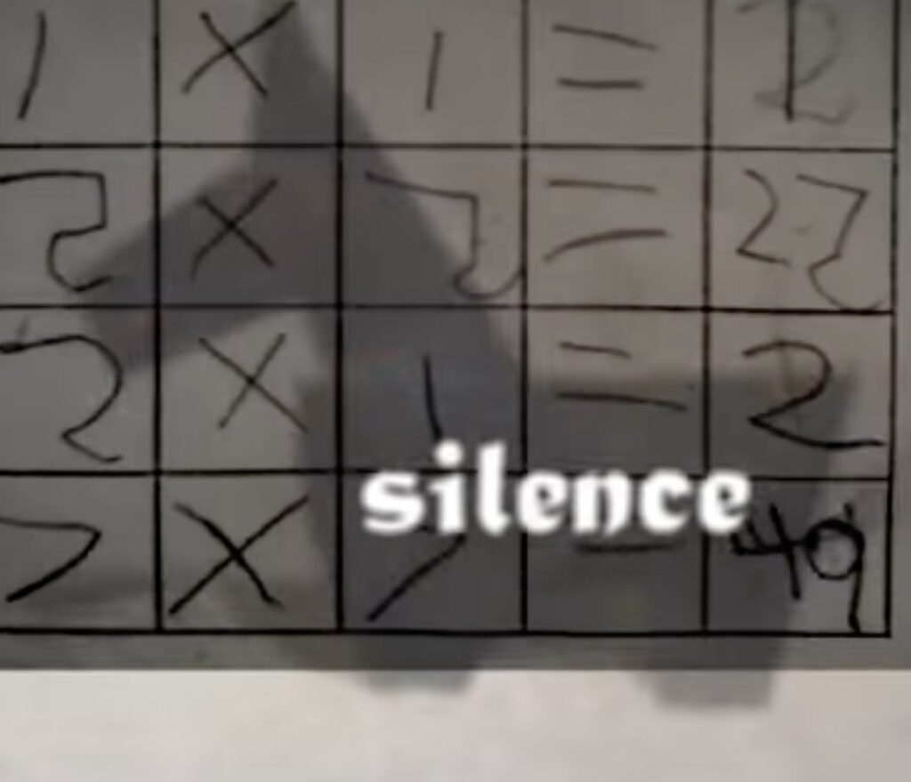 still from video that says silence